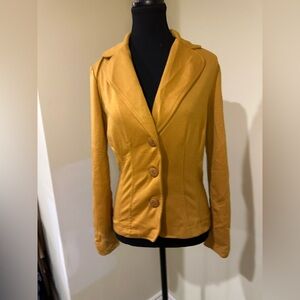 mustard yellow fitted blazer with a tailored design